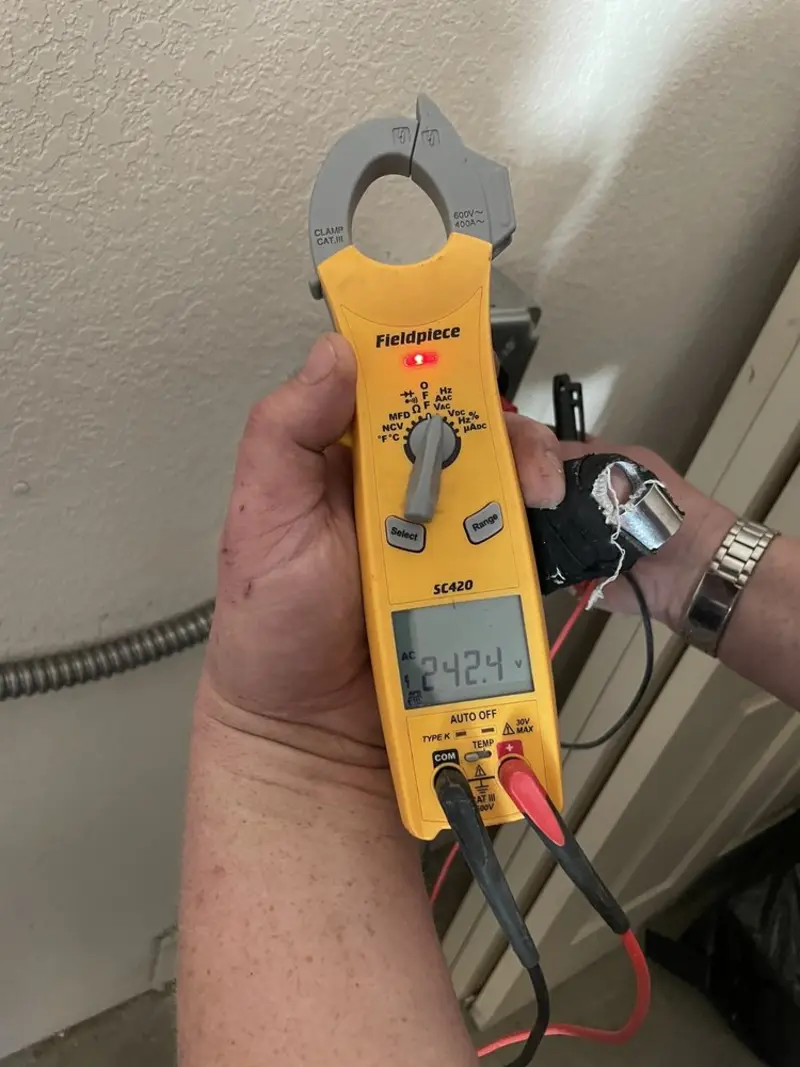 Voltage testing with clamp meter during Ceiling Fan Installation in Adel